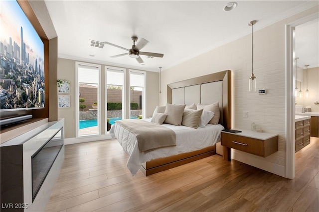 bedroom featuring ceiling fan, visible vents, access to exterior, light wood-type flooring, and ornamental molding