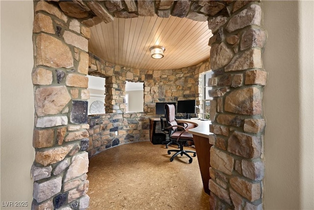 office with built in desk and wooden ceiling