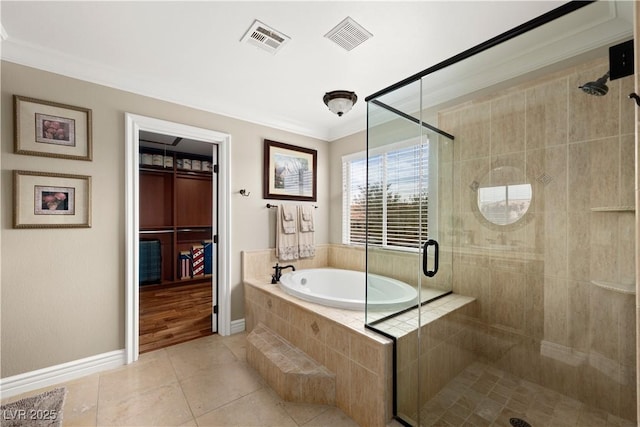 bathroom with visible vents, crown molding, a bath, and a stall shower