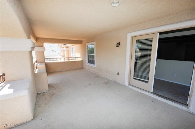 view of patio with a balcony