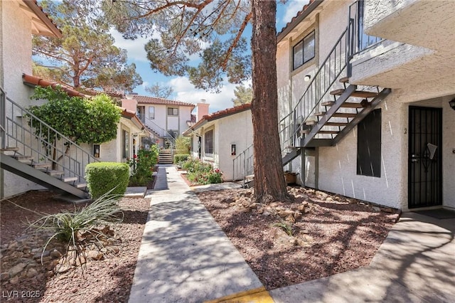surrounding community with a residential view and stairs