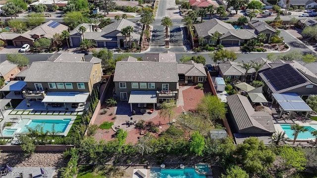 aerial view of residential area featuring a pool