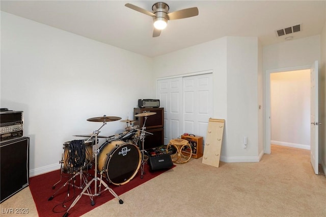 game room with carpet floors, ceiling fan, and baseboards
