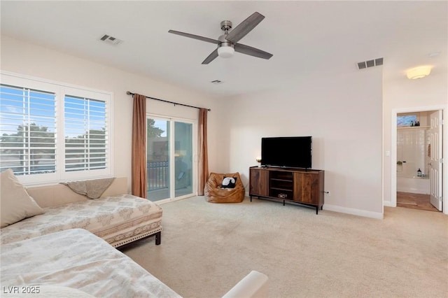living area with carpet flooring, a ceiling fan, and baseboards
