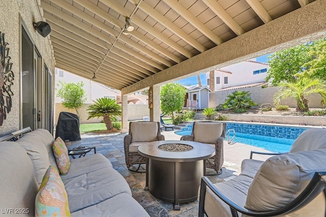 13 Cozy Glen Cir, Henderson, NV 89074 - view of patio / terrace with a fire pit, a fenced backyard, a shed, a fenced in pool, and an outbuilding