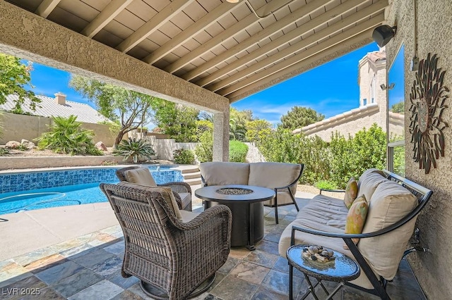 13 Cozy Glen Cir, Henderson, NV 89074 - view of patio with a fenced in pool, a fenced backyard, and an outdoor living space with a fire pit