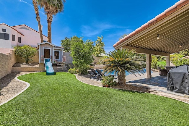13 Cozy Glen Cir, Henderson, NV 89074 - view of yard with a patio, a fenced backyard, and a playground