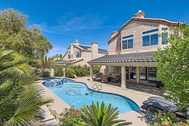 13 Cozy Glen Cir, Henderson, NV 89074 - view of pool featuring a patio, a pool with connected hot tub, and outdoor lounge area
