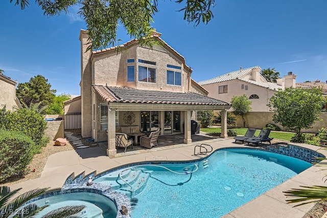 13 Cozy Glen Cir, Henderson, NV 89074 - view of pool with fence, a pool with connected hot tub, and a patio area