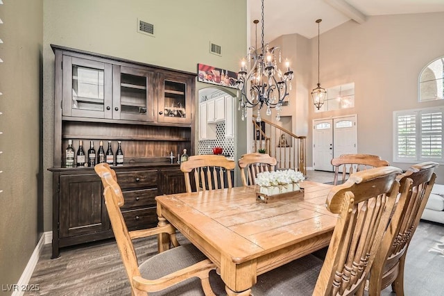 13 Cozy Glen Cir, Henderson, NV 89074 - dining space with high vaulted ceiling, beamed ceiling, wood finished floors, and visible vents