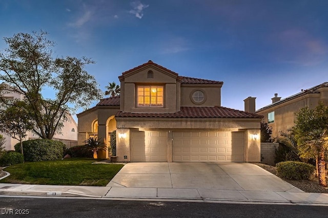 13 Cozy Glen Cir, Henderson, NV 89074 - mediterranean / spanish house featuring stucco siding, driveway, a tile roof, and a front yard