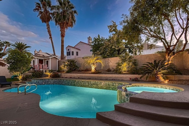 13 Cozy Glen Cir, Henderson, NV 89074 - view of swimming pool featuring a fenced backyard and a pool with connected hot tub