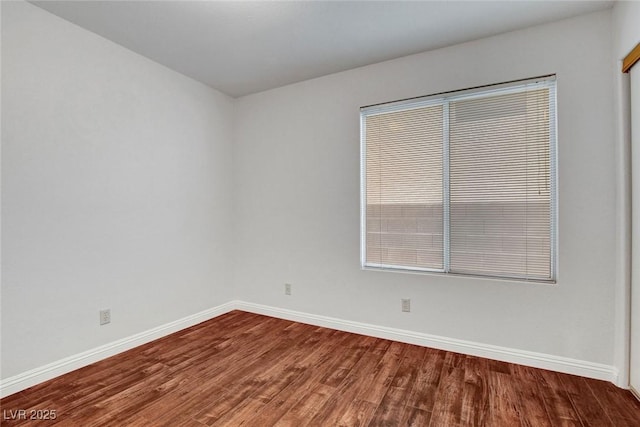 8236 Bermuda Beach Dr, Las Vegas, NV 89128 - empty room featuring baseboards and wood finished floors