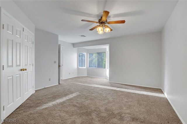 8236 Bermuda Beach Dr, Las Vegas, NV 89128 - unfurnished bedroom featuring carpet and ceiling fan