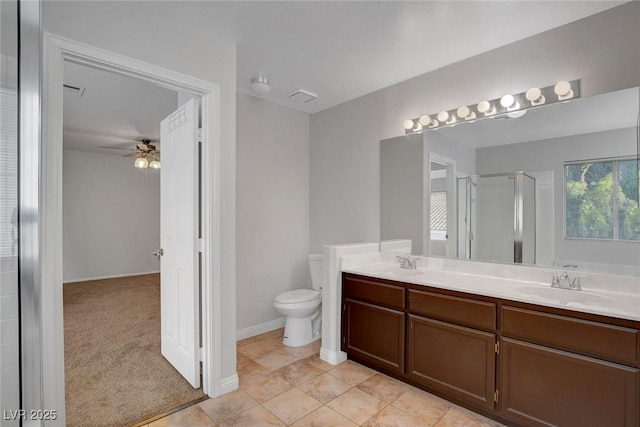 8236 Bermuda Beach Dr, Las Vegas, NV 89128 - bathroom featuring double vanity, a shower stall, and a ceiling fan