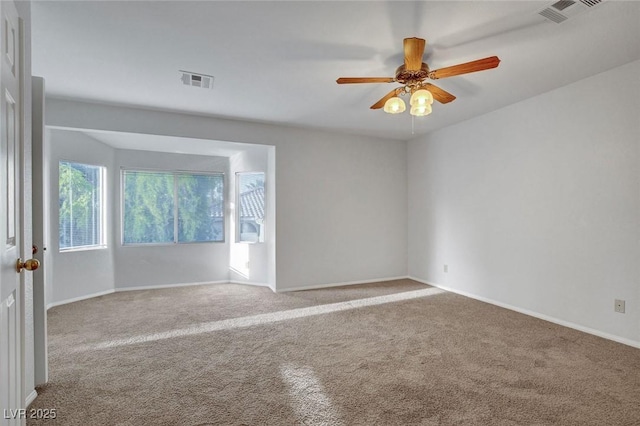 8236 Bermuda Beach Dr, Las Vegas, NV 89128 - empty room with visible vents, carpet flooring, baseboards, and a ceiling fan