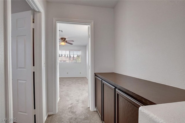 8236 Bermuda Beach Dr, Las Vegas, NV 89128 - hallway featuring light carpet and baseboards