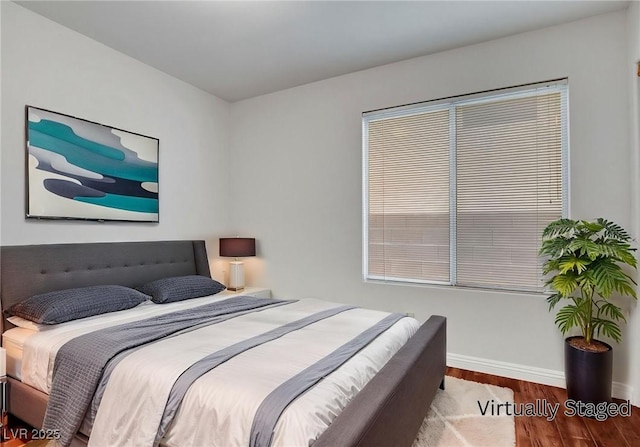 8236 Bermuda Beach Dr, Las Vegas, NV 89128 - bedroom featuring wood finished floors and baseboards