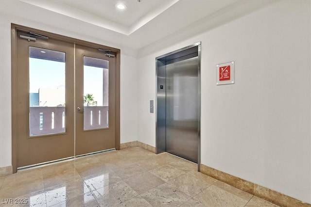 59 E Agate Ave Unit 406, Las Vegas, NV 89123 - doorway to outside featuring french doors, elevator, and baseboards