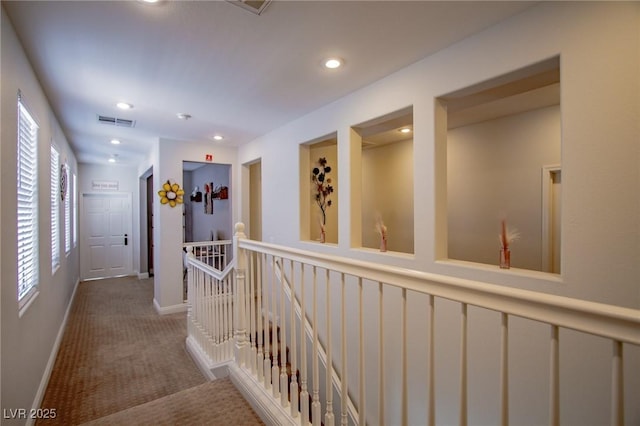 1125 Via Canale Dr, Henderson, NV 89011 - corridor with recessed lighting, carpet flooring, an upstairs landing, visible vents, and baseboards