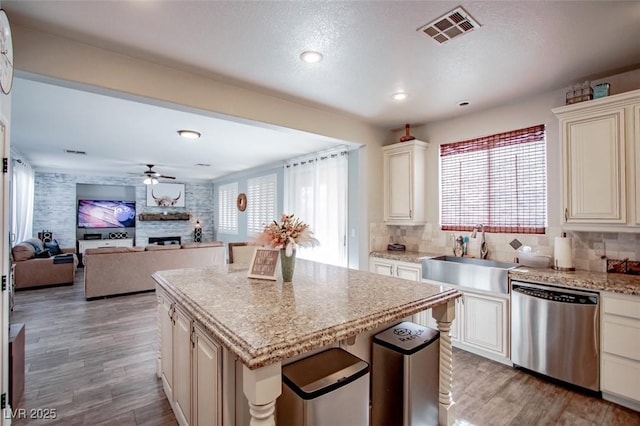 1125 Via Canale Dr, Henderson, NV 89011 - kitchen featuring visible vents, stainless steel dishwasher, plenty of natural light, and a sink
