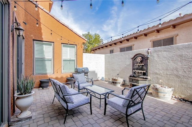 1125 Via Canale Dr, Henderson, NV 89011 - view of patio with a fenced backyard and area for grilling