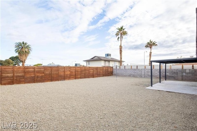 view of yard with a patio and a fenced backyard
