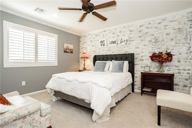 bedroom with baseboards, visible vents, light carpet, and crown molding