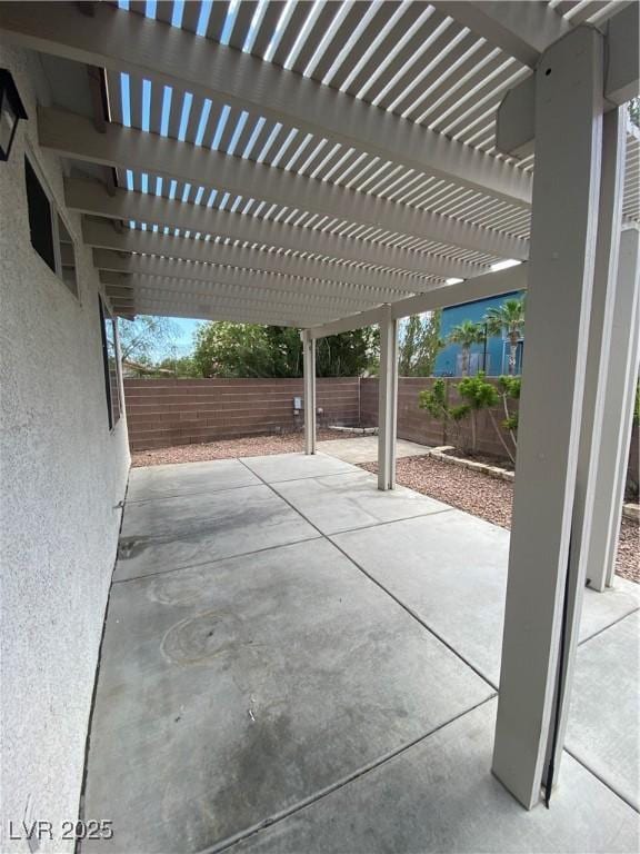 view of patio / terrace with a fenced backyard and a pergola