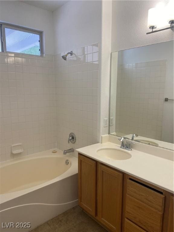 bathroom featuring tile patterned floors,  shower combination, and vanity
