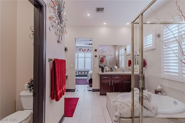 ensuite bathroom with a bath, ensuite bathroom, vanity, visible vents, and a ceiling fan
