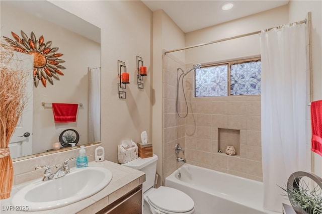 bathroom with shower / bath combo with shower curtain, toilet, and vanity