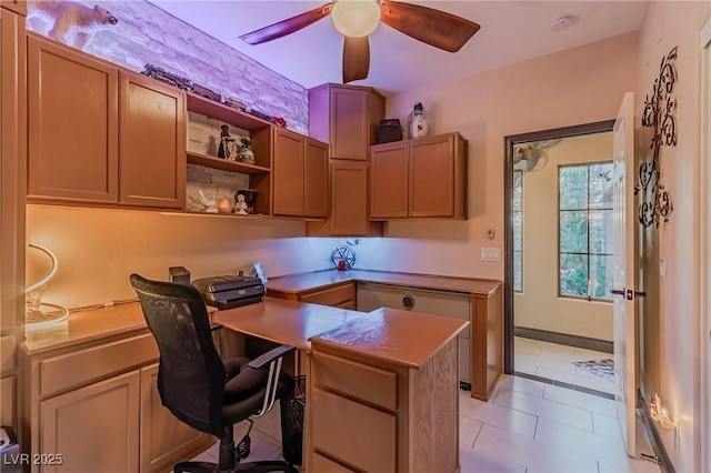 office space featuring light tile patterned flooring and a ceiling fan