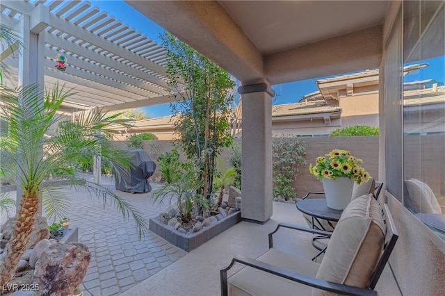 view of patio / terrace with a fenced backyard and a pergola