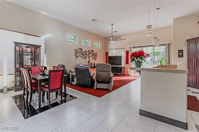 dining space with ceiling fan and visible vents