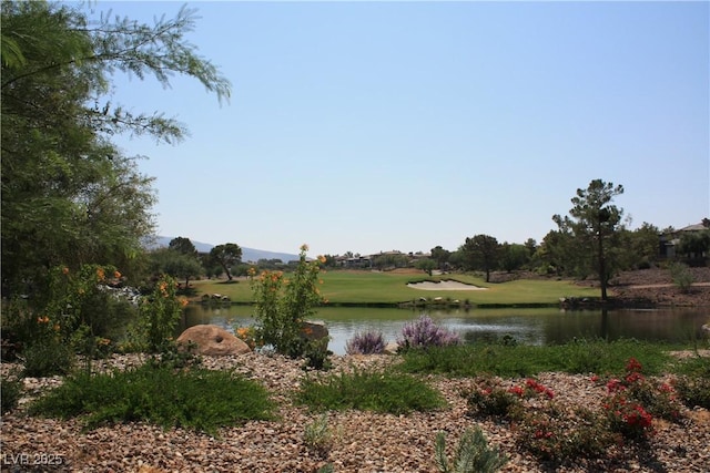 property view of water with view of golf course