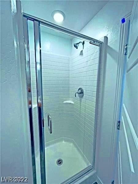 bathroom featuring a shower stall