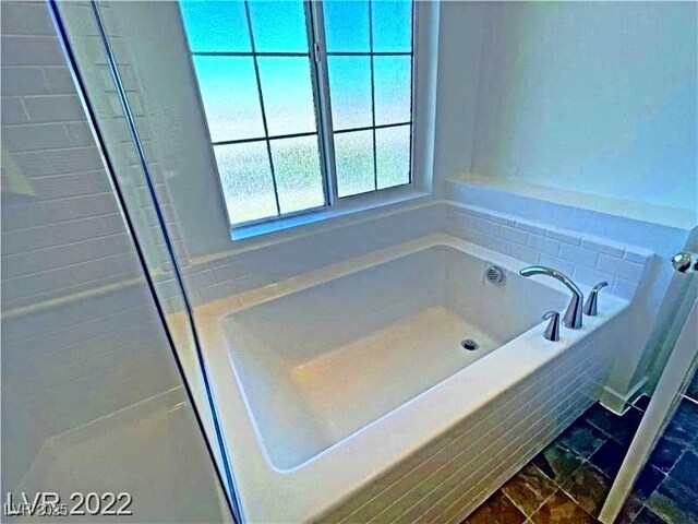 full bathroom featuring a bath