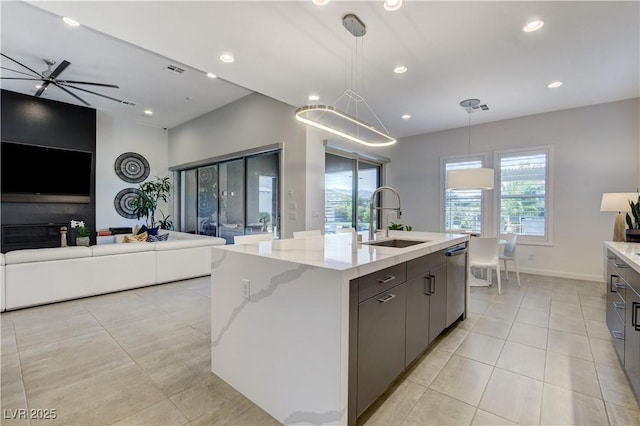 10004 Terrastone Dr, Las Vegas, NV 89148 - kitchen with light tile patterned floors, a sink, open floor plan, dishwasher, and recessed lighting