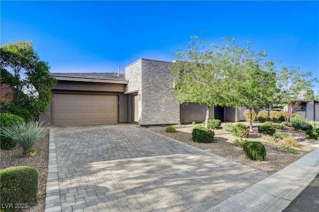 10004 Terrastone Dr, Las Vegas, NV 89148 - view of front of property featuring stucco siding, decorative driveway, and an attached garage