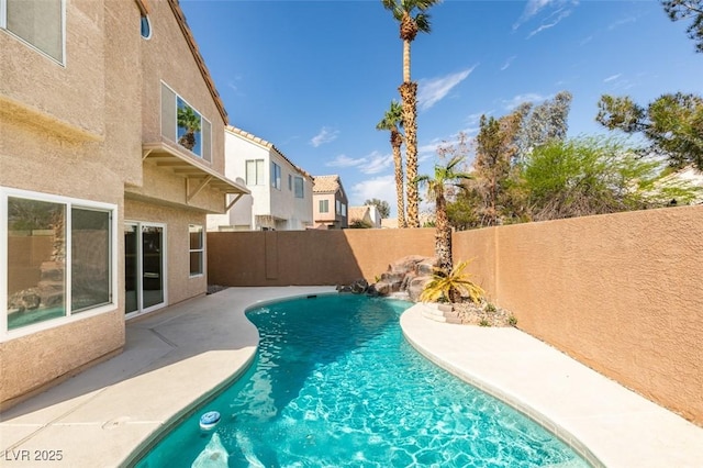 view of pool featuring a fenced backyard, a fenced in pool, and a patio area