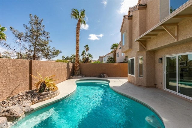 view of swimming pool featuring a fenced in pool, a patio area, and a fenced backyard
