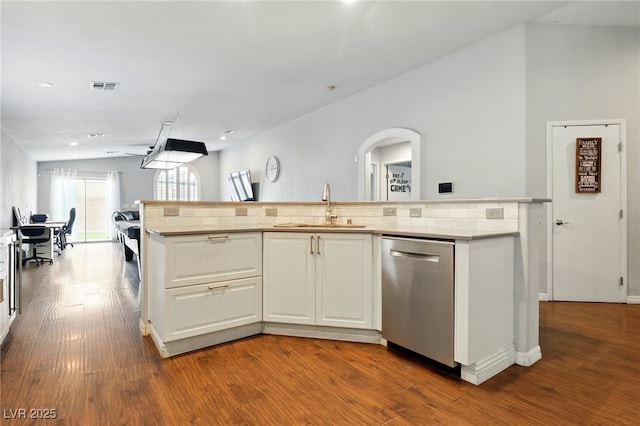 kitchen with a sink, dark wood finished floors, white cabinetry, stainless steel dishwasher, and visible vents