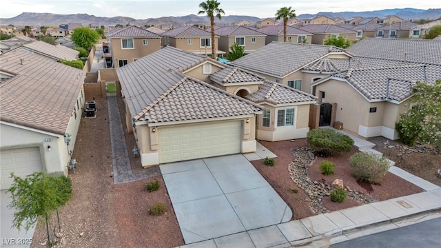 birds eye view of property featuring a residential view and a mountain view