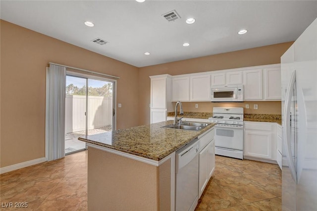 8988 Winchester Ridge St, Las Vegas, NV 89139 - kitchen featuring a sink, visible vents, light stone counters, white appliances, and white cabinets
