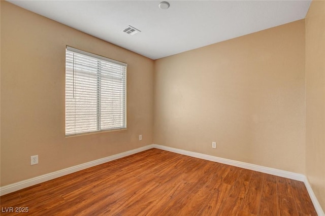 8988 Winchester Ridge St, Las Vegas, NV 89139 - unfurnished room featuring baseboards, visible vents, and wood finished floors