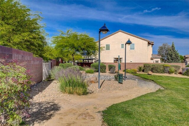 8988 Winchester Ridge St, Las Vegas, NV 89139 - view of yard featuring fence