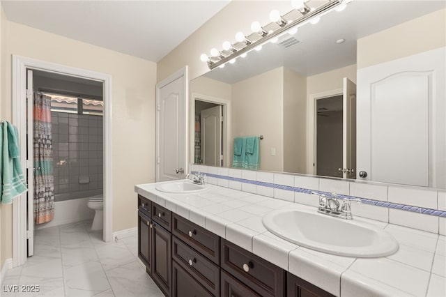 1265 Vietti St, Henderson, NV 89012 - bathroom featuring double vanity, marble look tiles, and shower / bath combination with curtain