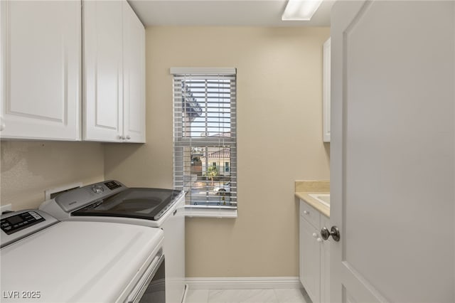 1265 Vietti St, Henderson, NV 89012 - laundry room featuring independent washer and dryer, cabinet space, and light marble finish flooring