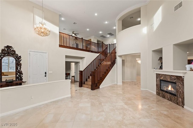 1265 Vietti St, Henderson, NV 89012 - foyer with ceiling fan, a towering ceiling, a premium fireplace, recessed lighting, and a chandelier